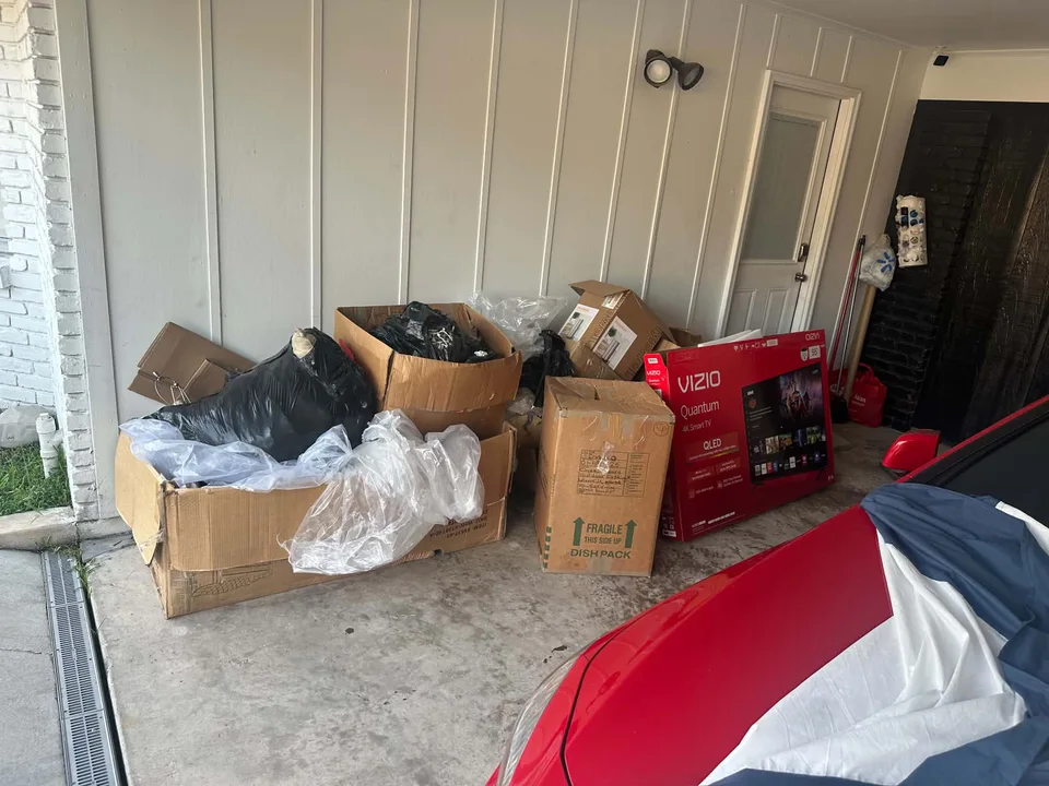 Boxes and bags gathered inside a garage