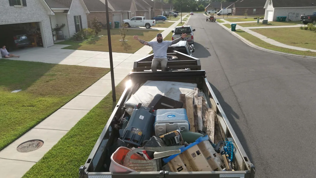 Household items in a loaded trailer on a residential street